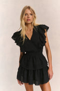 Black V-neck mini dress with layered ruffle sleeves, tiered skirt and elastic waist