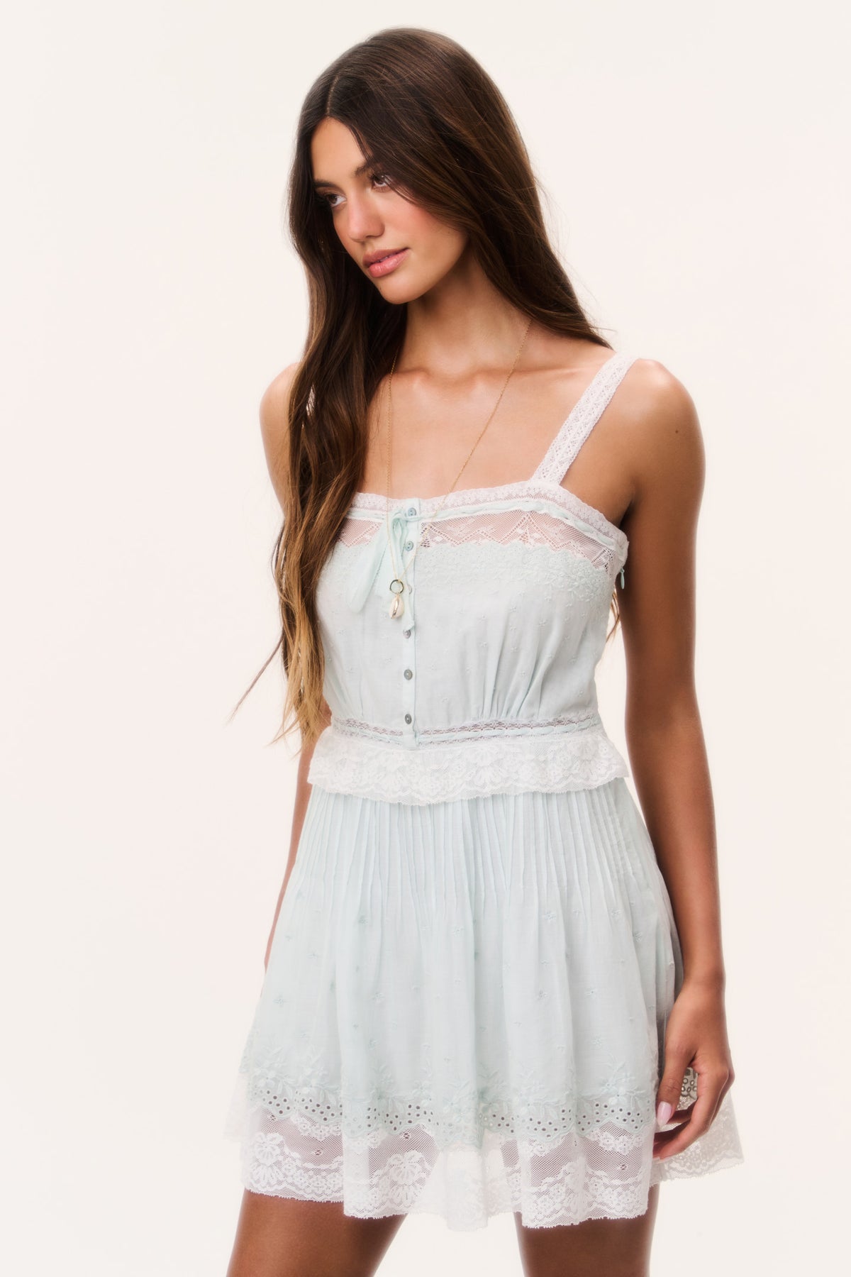 Light blue cotton mini dress with lace-trim straps, button placket, tiered skirt