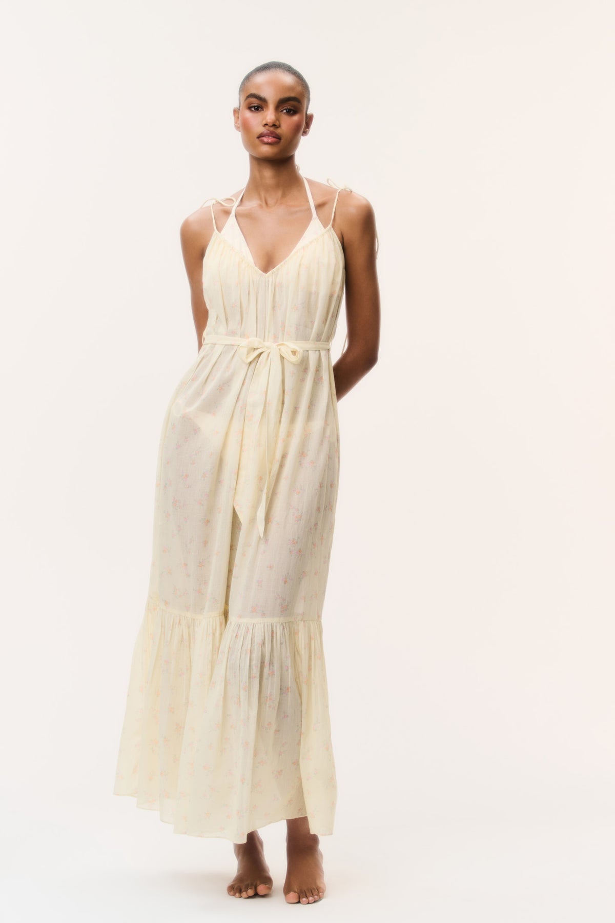 Light yellow cotton cover-up dress with V-neck, tie straps, tiered skirt, ruffle hem