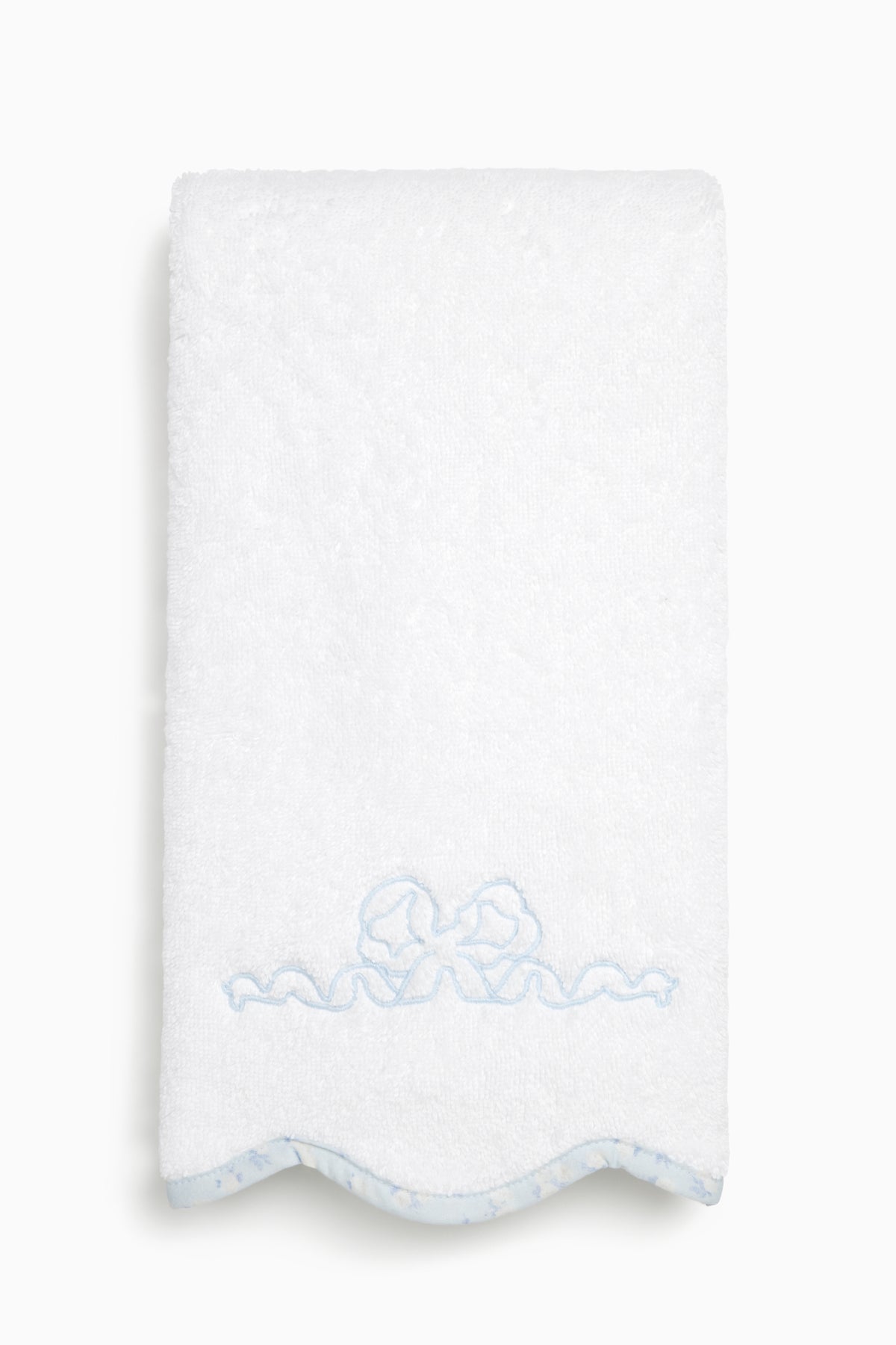 White hand towel with light blue bow embroidery and scalloped trim