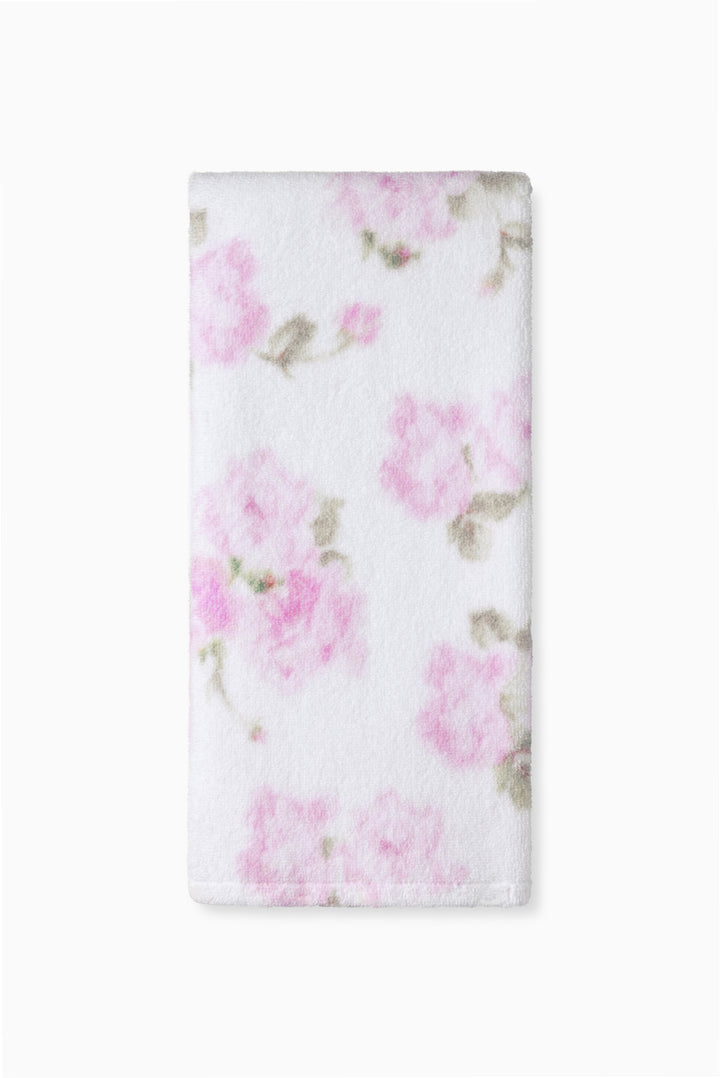 White printed hand towel with pink floral and small leaf motifs