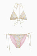 Two-piece bikini set laid flat: light blue floral triangle top and side-tie bottoms