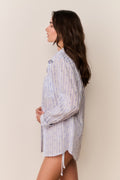 Light blue patterned cotton unisex shirt with side tie hem, button-up collar, long sleeves