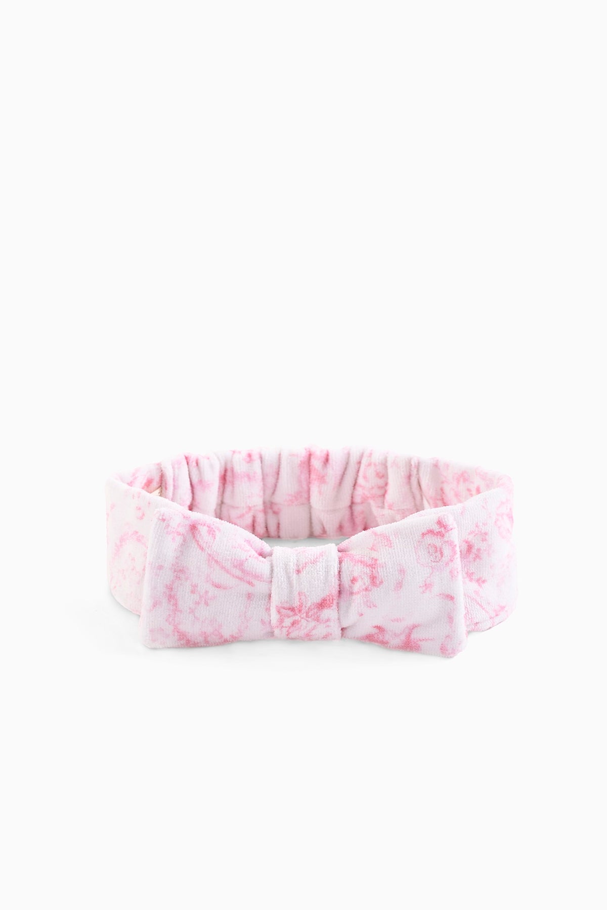 Pink patterned bow headband with gathered ruffle and stitched fabric bow