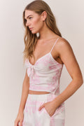 Ivory camisole top with pink floral print, spaghetti straps, bow-front detail