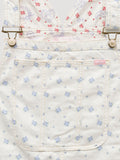 Women’s ecru overall waistband close-up with blue micro-print and patch pocket