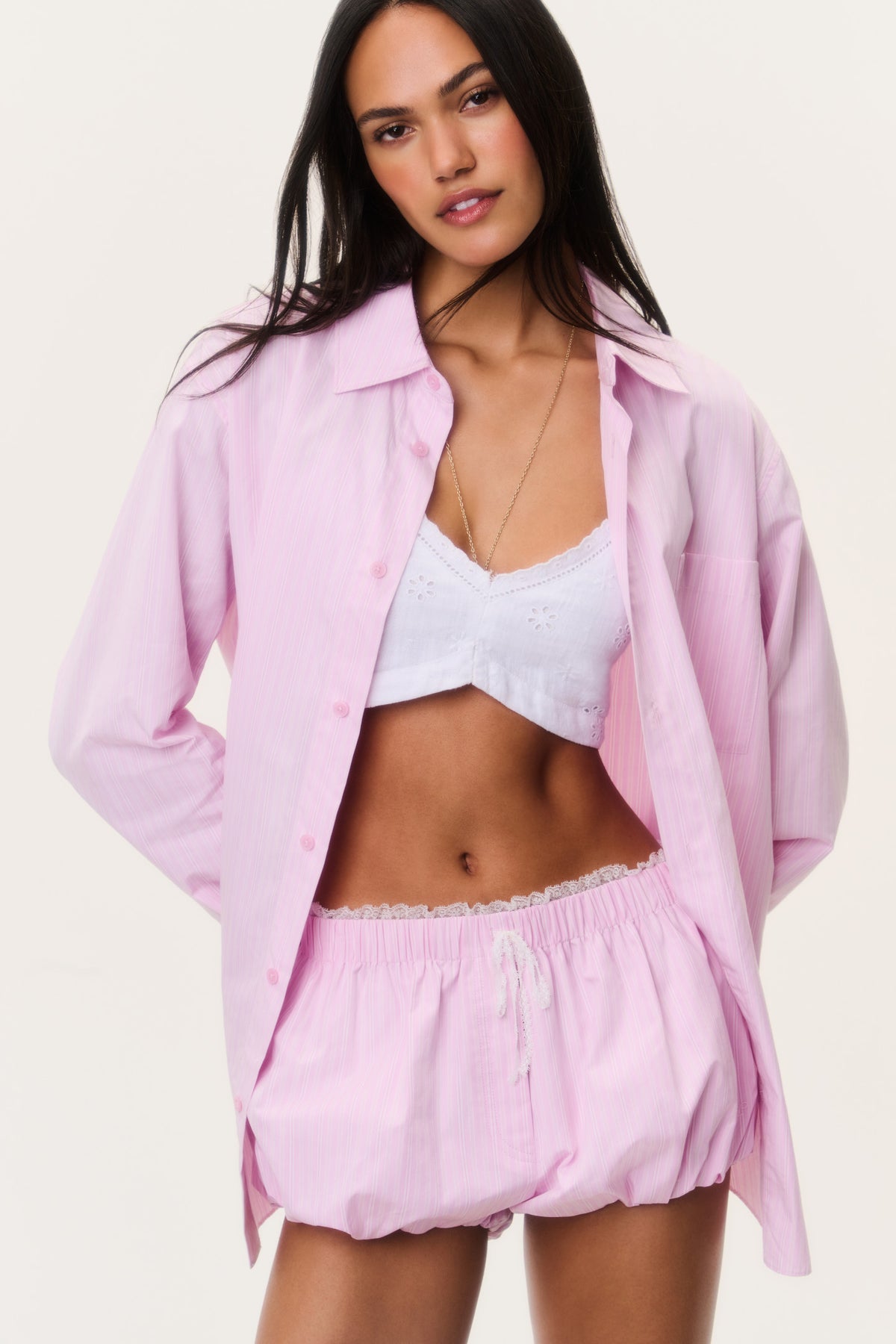 Pink pinstripe unisex button-up shirt with chest pocket and long sleeves