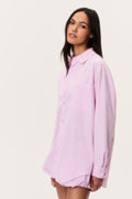 Pink pinstripe unisex button-up shirt, side view with long sleeves