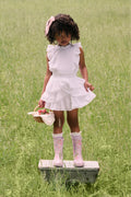Kids classic rain boots in light pink with floral print and ruffled cuffs