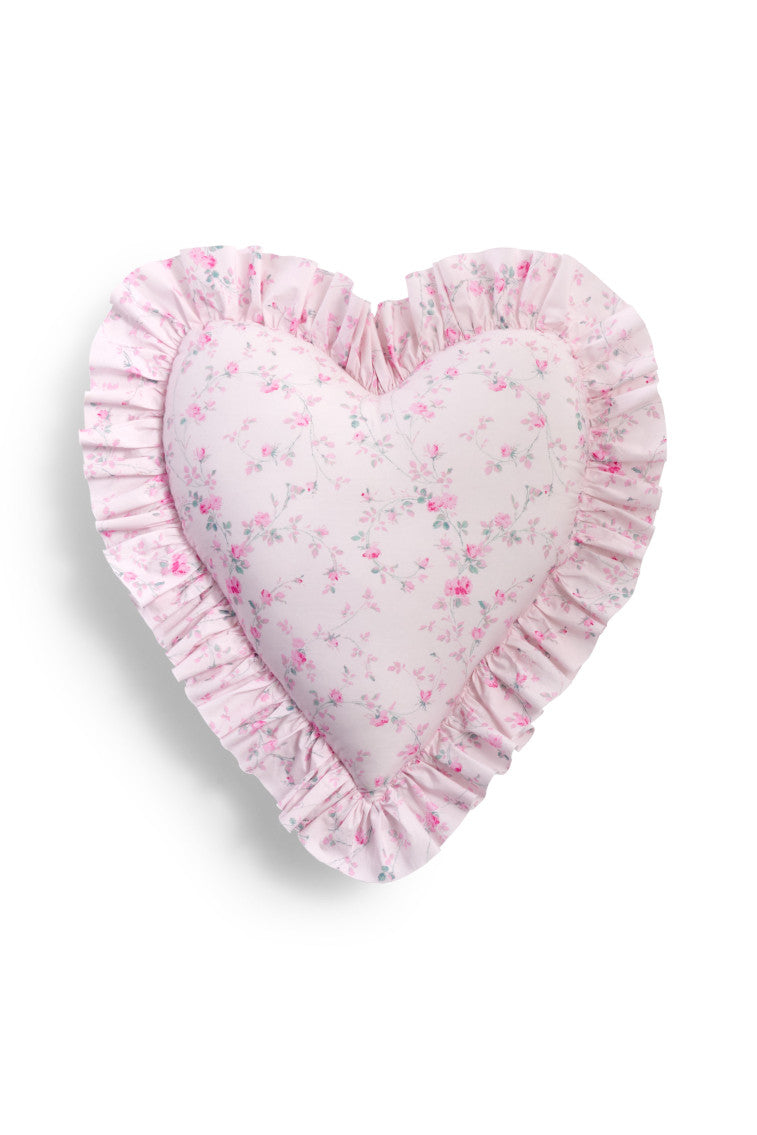 Heart-shaped ruffle pillow in pale pink with small floral print