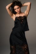 Black satin camisole top with ornate lace V panel at bust and thin straps