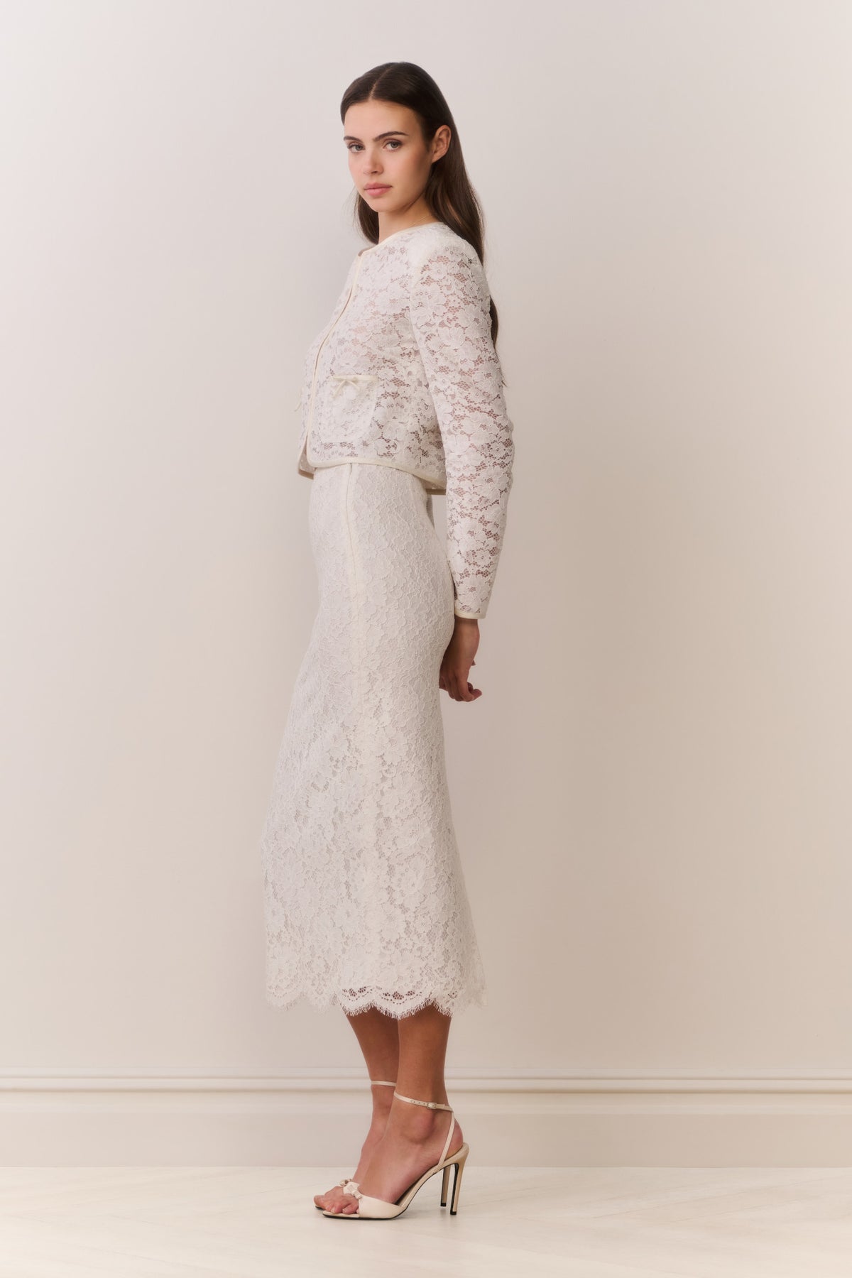 Ivory lace midi pencil skirt with straight fitted silhouette