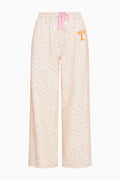 Womenโs wide-leg sweatpants with elastic waist, pink drawstring, and pale floral print