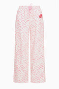 Pink floral-print sweatpants with elastic waist and drawstring, wide straight legs