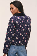 Dark navy floral quilted jacket with all-over pink flower pattern, back view