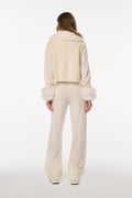 Ivory faux fur vest back view with cropped length and plush fur edging