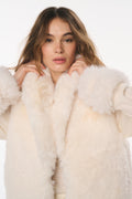 Ivory faux fur vest with thick shawl collar and textured plush finish