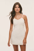 Ivory tweed slip dress with V-neck and spaghetti straps, beaded hem trim