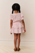 Pink lace-trimmed cotton dress with gathered ruffles and tiered skirt (back)