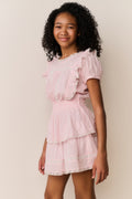 Pink cotton mini dress with puff sleeves and tiered ruffle skirt, front view