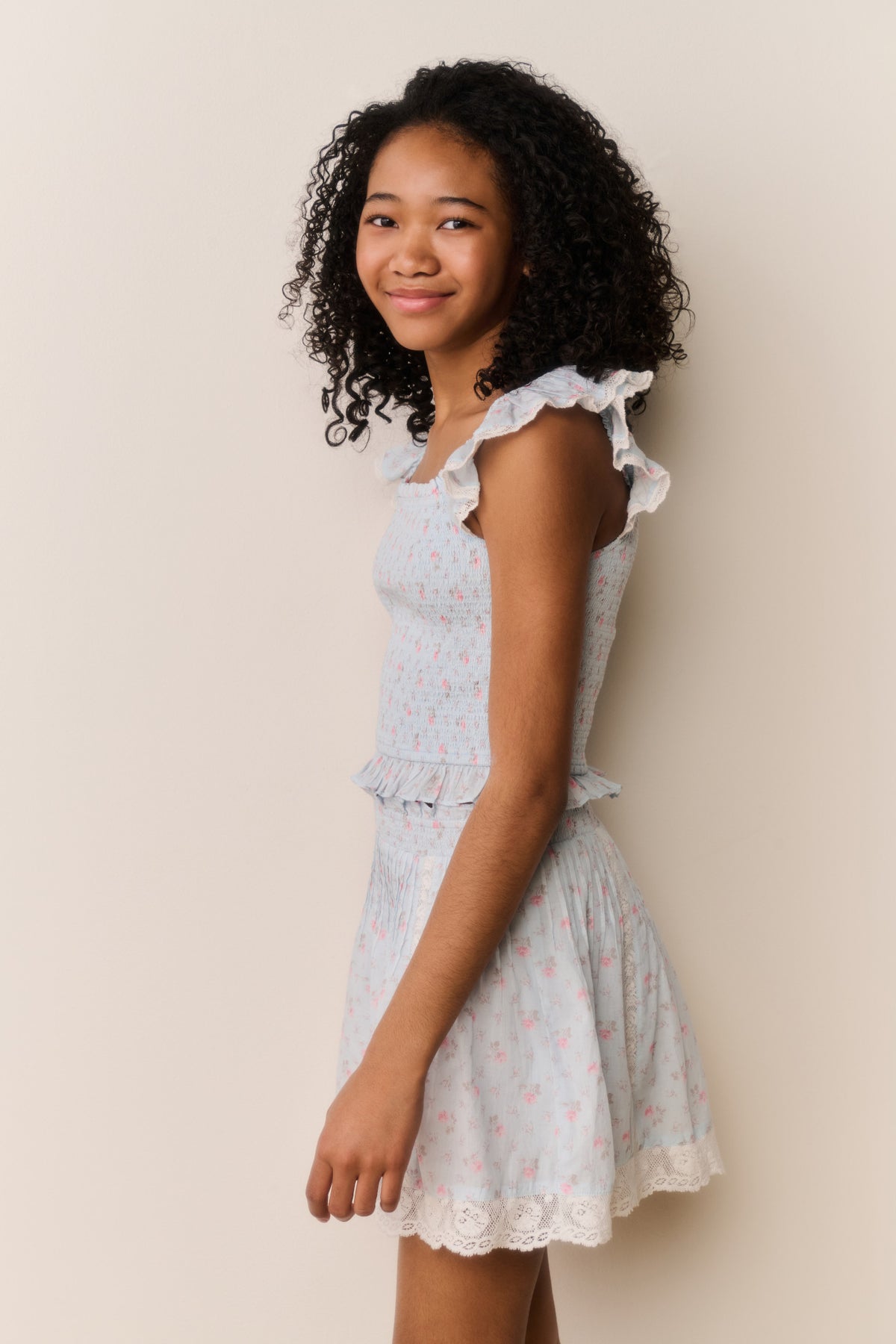 Floral cotton top with ruffled cap sleeves and tiered peplum hem, light blue