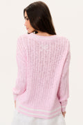 Pink back view of cable knit pullover sweater with V-neck ribbed striped hem