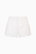 White linen eyelet shorts with scalloped hem and embroidered eyelet detailing