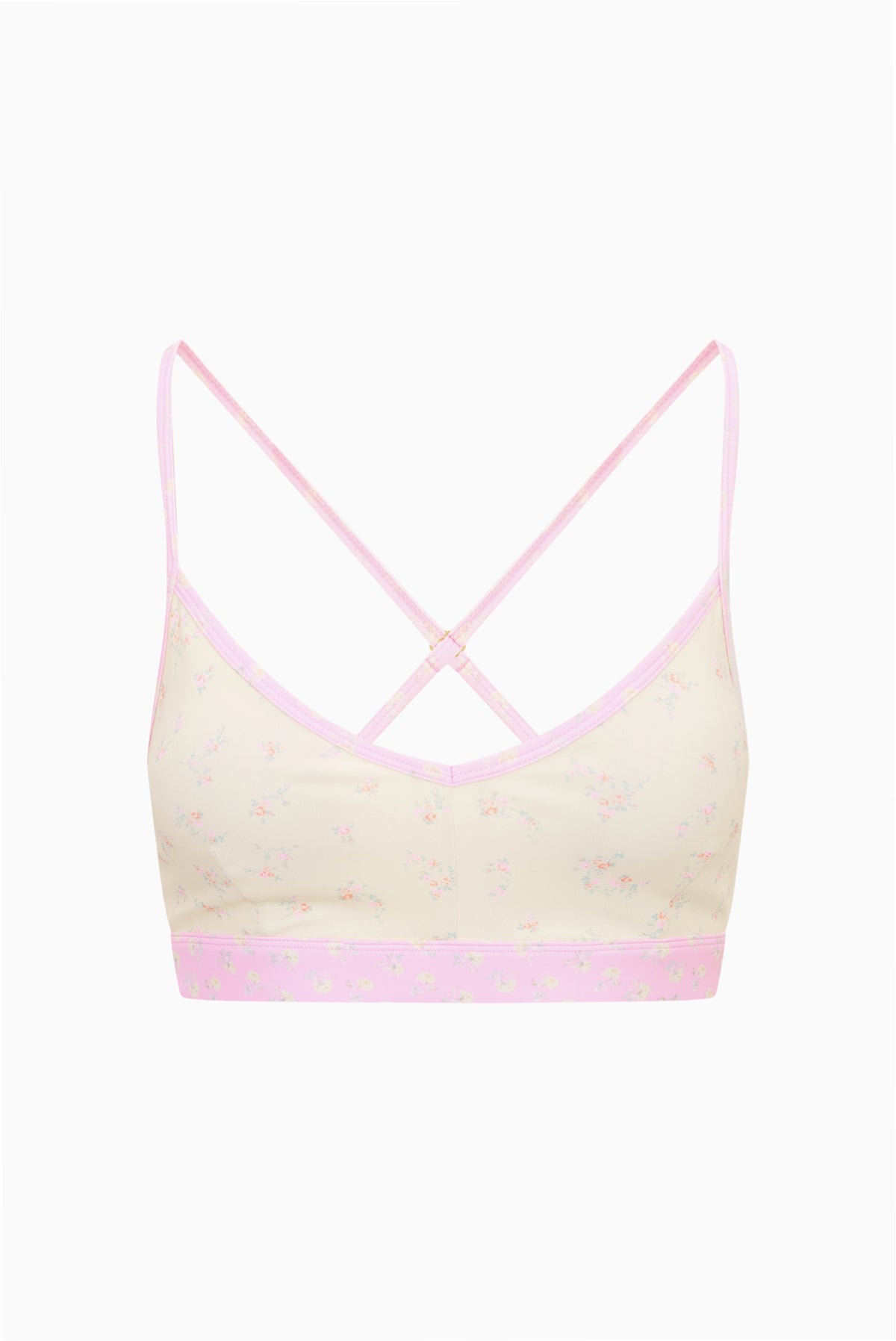 Ditsy floral sports bra, pale background with pink trim, crisscross open-back straps