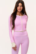 Pink patterned active jacket with long sleeves and full front zipper detail