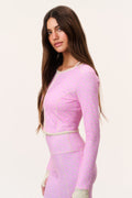 Pink patterned cropped active jacket with front zipper and long sleeves