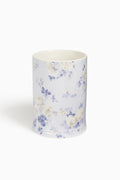 Porcelain tumbler with blue floral pattern on white