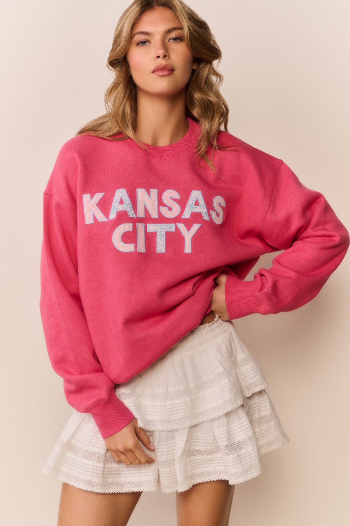 Palo Location pullover in pink with 'KANSAS CITY' graphic, dropped shoulder