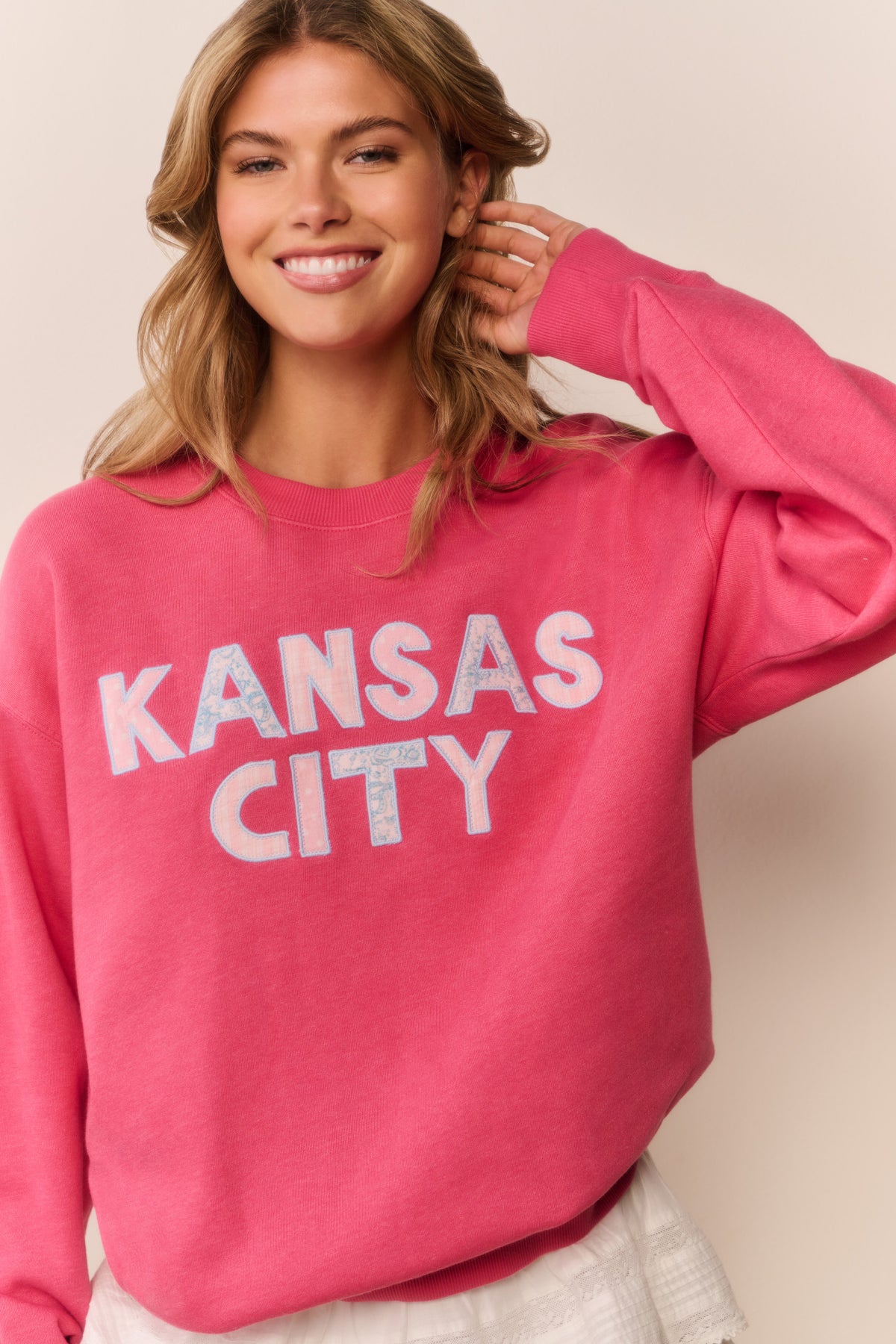 Palo Location pullover in pink with 'KANSAS CITY' graphic on crewneck