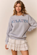 Palo Location pullover in light gray-blue with 'ATLANTA' graphic, long sleeves
