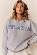 Palo Location pullover in light gray-blue with 'ATLANTA' graphic on crewneck