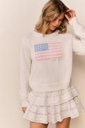 Ivory crewneck flag pullover sweater with front flag print and tiered skirt
