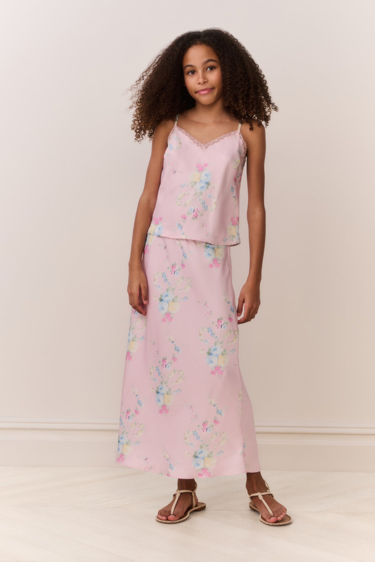 Front view of light pink floral maxi skirt with allover pastel flowers