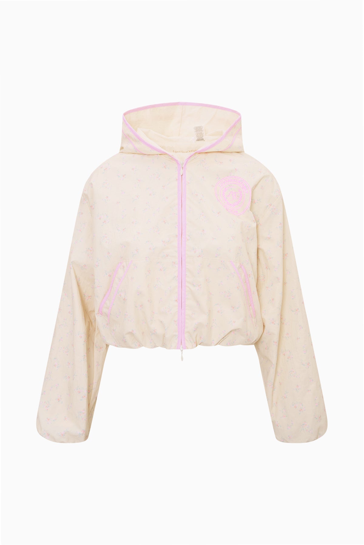 Cream windbreaker hoodie with pink trim, front zipper, and hood