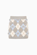 Flat knit tween skirt with light blue and white argyle, ribbed waistband and ties