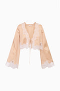 Silk-blend top with lace yoke, V-neck, and tie front; long sleeves