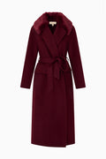 Dark merlot long wool coat with faux fur collar and tied waist belt, front view.