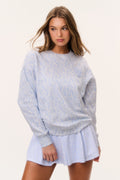 Light blue tennis print pullover with crew neck and long sleeves, relaxed fit