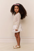 Side view of girls alpaca-wool cardigan in white, long sleeves, textured knit