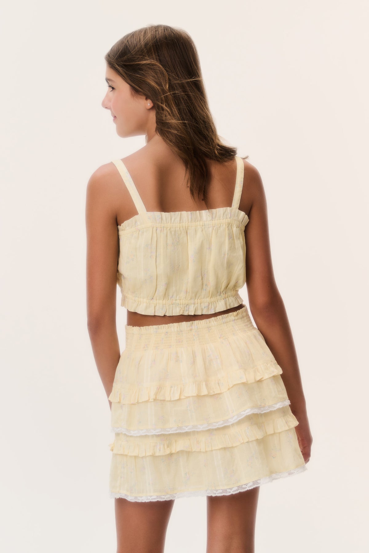 Lemon yellow tiered ruffle mini skirt with ditsy floral print and elastic waist, side view