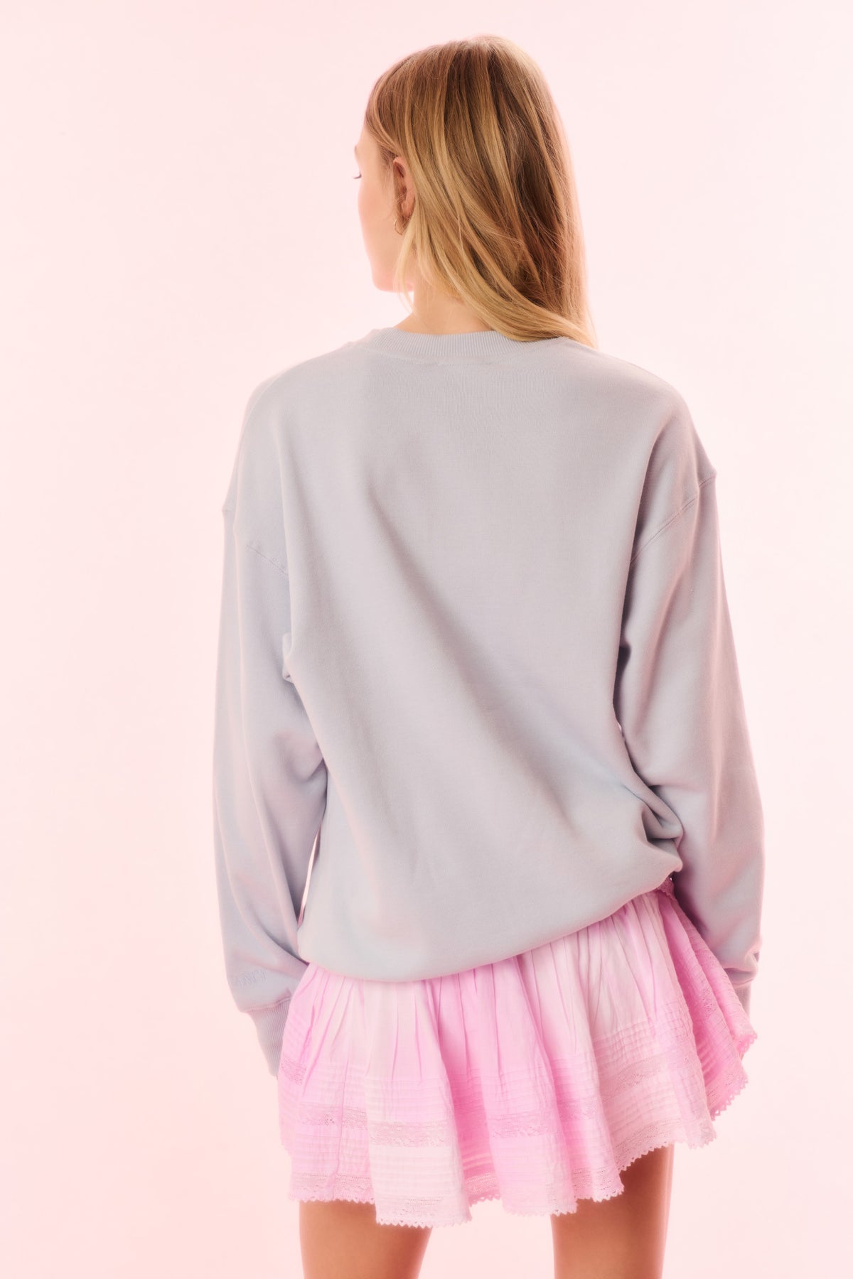 Light lavender pullover sweatshirt with back seam detail and relaxed long sleeves