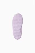 Underside view of kids rain boot sole in light lavender rubber tread.