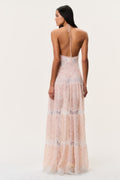 Back view of pink floral sheer maxi dress with spaghetti straps and tiered skirt
