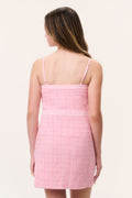 Back view of pink tweed sleeveless dress with spaghetti straps and straight hem