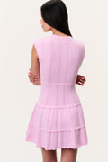 Back view of candy pink stretch pointelle mini dress with tiered ruffle skirt