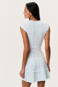 Back view of dusty lagoon blue stretch pointelle mini dress with tiered ruffle skirt